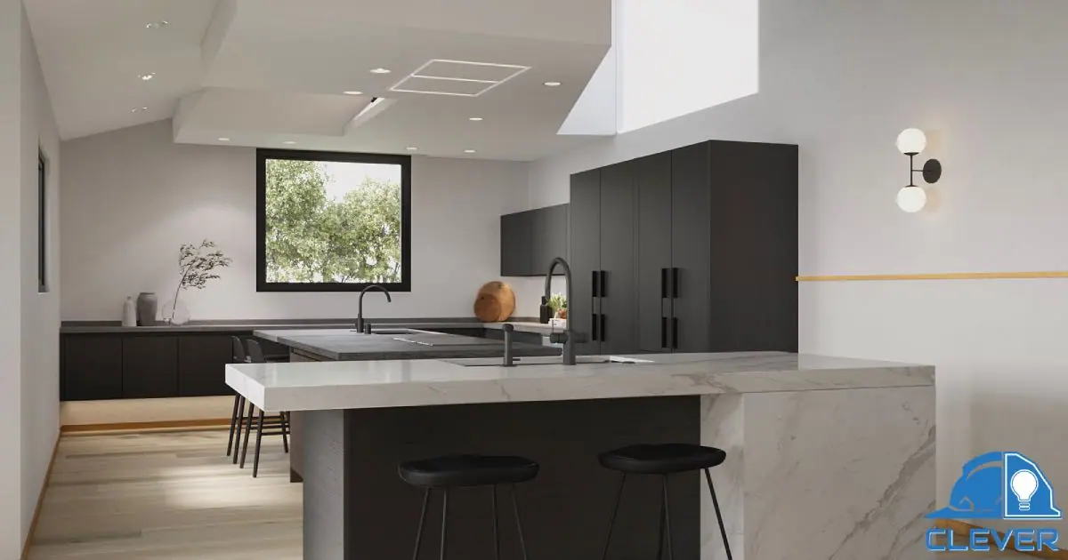 Second view of the kitchen islands, quartz counters and full-height dark cabinets