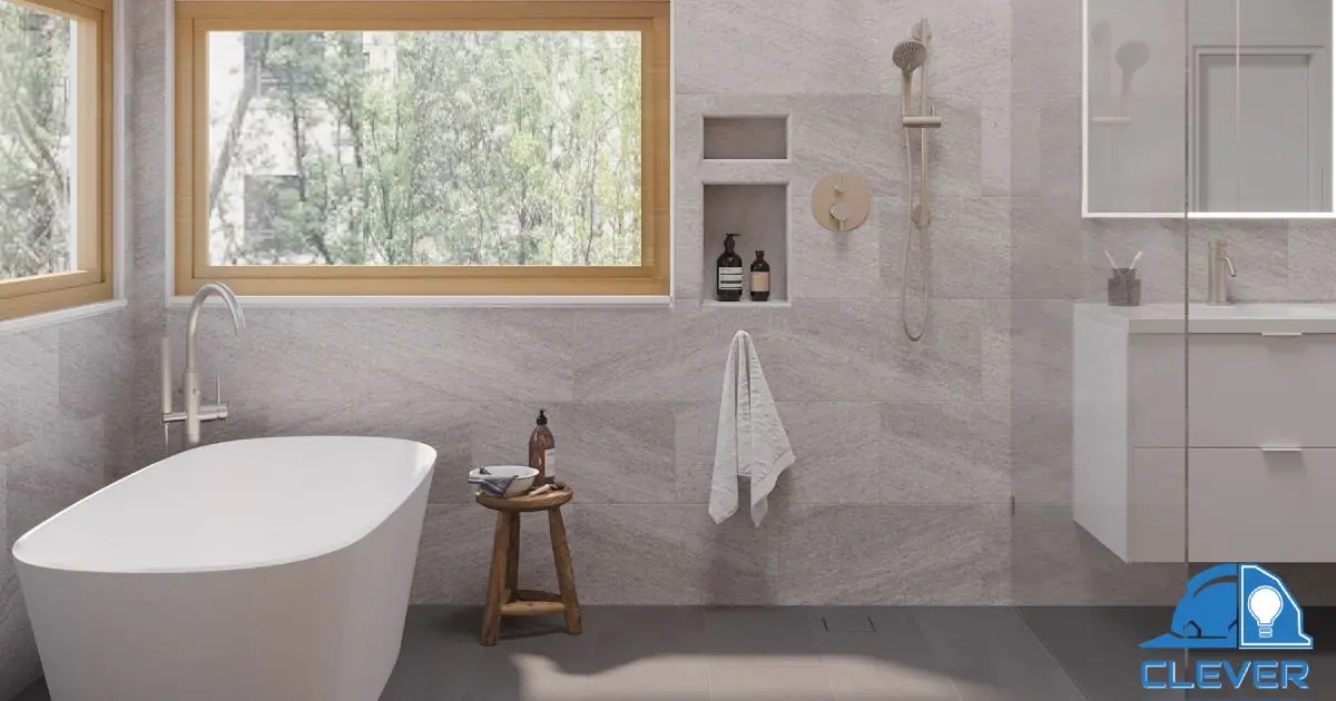 Soaking tub under a wood-framed window with a tiled shower niche