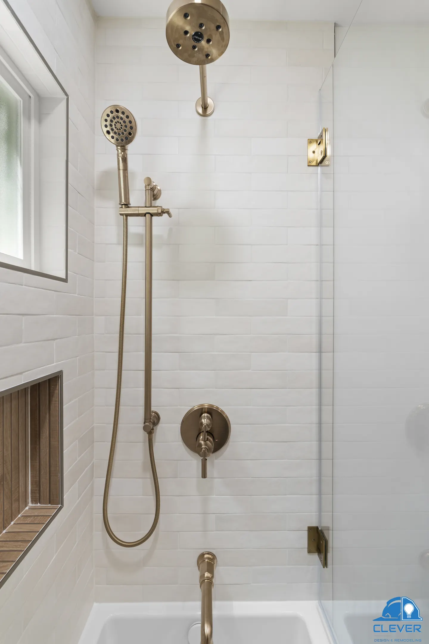 Brass rain head and handheld shower with a wood-look tile niche, kitchen and bath remodel in Los Gatos, CA